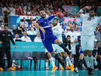 Nedim Remili of the France team is shooting the ball during the Men's Preliminary Round Group B match between France and Egypt in Paris, Fra...