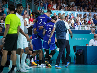 Yanis Lenne of the France Team is getting injured during the Men's Preliminary Round Group B match between France and Egypt in Paris, France...