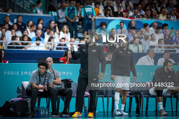 Karim HENDAWY, the goalkeeper of the Egypt team, is playing during the men's Handball Preliminary Round - Group B match between France and E...