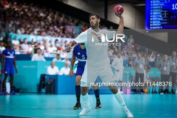 Yahia OMAR of the Egypt team is shooting the ball during the Men's Preliminary Round Group B match between France and Egypt on day five of t...