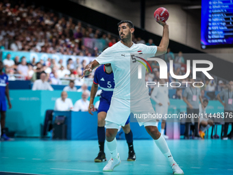 Yahia OMAR of the Egypt team is shooting the ball during the Men's Preliminary Round Group B match between France and Egypt on day five of t...