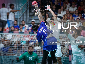 Elohim PRANDI of the France team is shooting at the goal against Ibrahim ELMASRY of the Egypt team during the men's Handball Preliminary Rou...