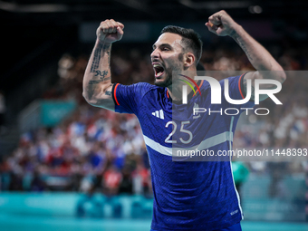 Hugo Descat of the France team is celebrating during the men's handball preliminary round - Group B match between France and Egypt in Paris,...