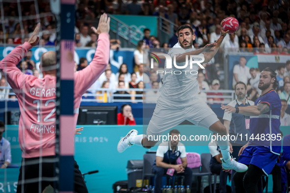 Yahia OMAR of the Egypt team is shooting the ball during the Men's Preliminary Round Group B match between France and Egypt on day five of t...