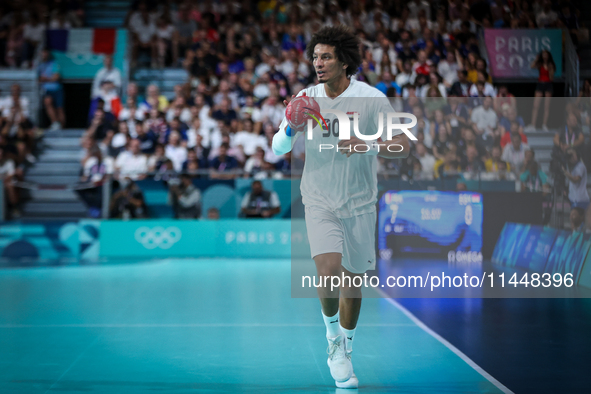 Ali ZEIN of the Egypt Team is playing during the men's Handball Preliminary Round - Group B match between France and Egypt in Paris, France,...