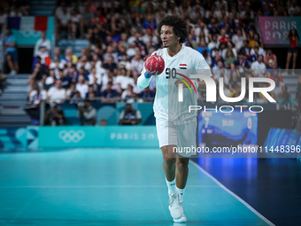 Ali ZEIN of the Egypt Team is playing during the men's Handball Preliminary Round - Group B match between France and Egypt in Paris, France,...