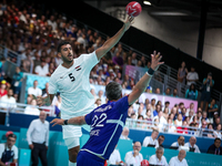 Yahia OMAR of the Egypt team is shooting at the goal against Luka KARABATIC of the France team during the men's Handball Preliminary Round -...