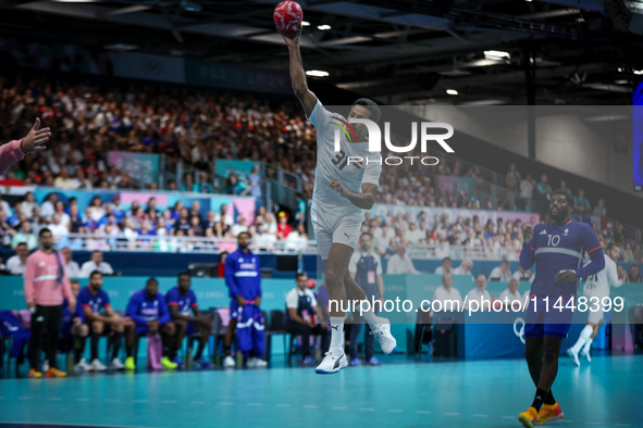 Omar ELWAKIL of the Egypt team is shooting the ball during the Men's Preliminary Round Group B match between France and Egypt on day five of...