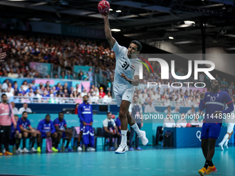 Omar ELWAKIL of the Egypt team is shooting the ball during the Men's Preliminary Round Group B match between France and Egypt on day five of...