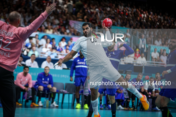 Ahmed ADEL of the Egypt team is shooting the ball during the Men's Preliminary Round Group B match between France and Egypt in Paris, France...