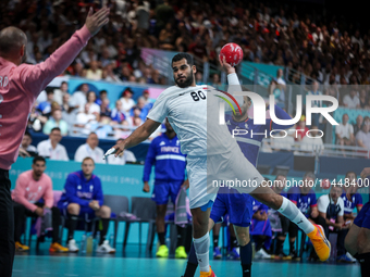 Ahmed ADEL of the Egypt team is shooting the ball during the Men's Preliminary Round Group B match between France and Egypt in Paris, France...