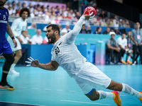 Ahmed ADEL of the Egypt team is shooting the ball during the Men's Preliminary Round Group B match between France and Egypt in Paris, France...