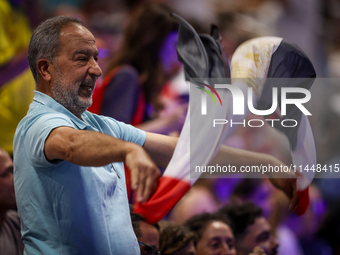 A fan of the Egypt team is cheering before the Men's Preliminary Round Group B match between France and Egypt on day five of the Olympic Gam...