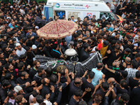 Kashmiri Shiite Muslims are reenacting the scene by touching the horse during a religious procession in Srinagar, Jammu and Kashmir, on Augu...