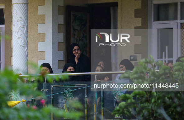 Kashmiri Shiite Muslim mourners are watching a religious procession on the 25th day of the Islamic month of Muharram in Srinagar, Jammu and...