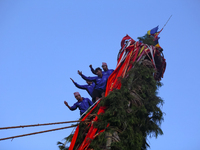 Nepali devotees are climbing up the chariot of the Red God, Rato Macchindranath, as it approaches the final tour of the city, wrapping up th...