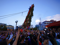 Nepali devotees are pulling the chariot of the Red God, Rato Macchindranath, to the resting point as it approaches the final tour of the cit...