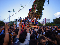 Nepali devotees are pulling the chariot of the Red God, Rato Macchindranath, to the resting point as it approaches the final tour of the cit...