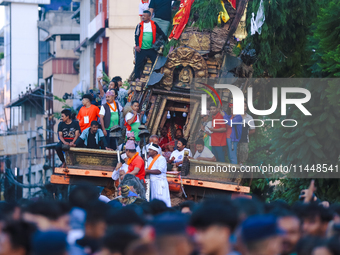 The idol of the Red God, Rato Macchindranath, is being pictured inside the sky-scraping chariot as it approaches the final tour of the city,...