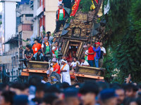 The idol of the Red God, Rato Macchindranath, is being pictured inside the sky-scraping chariot as it approaches the final tour of the city,...