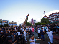 Nepali devotees are pulling the chariot of the Red God, Rato Macchindranath, to the resting point as it approaches the final tour of the cit...