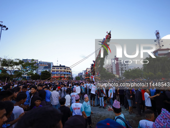 Nepali devotees are pulling the chariot of the Red God, Rato Macchindranath, to the resting point as it approaches the final tour of the cit...