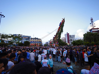 Nepali devotees are pulling the chariot of the Red God, Rato Macchindranath, to the resting point as it approaches the final tour of the cit...