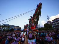 Nepali devotees are pulling the chariot of the Red God, Rato Macchindranath, to the resting point as it approaches the final tour of the cit...