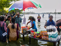 Women are preparing snacks at a small snack stand in the water along Sambranikodi Island in Kerala, India, on April 06, 2024. Sambranikodi I...