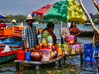 A woman is preparing snacks at a small snack stand in the water along Sambranikodi Island in Kerala, India, on April 06, 2024. Sambranikodi...