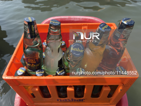 Cool drinks are being served at a snack stand along Sambranikodi Island in Kerala, India, on April 06, 2024. 