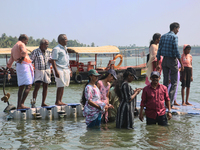 Indian tourists are standing on a small floating pier at Sambranikodi Island in Kerala, India, on April 06, 2024. Sambranikodi Island is sit...