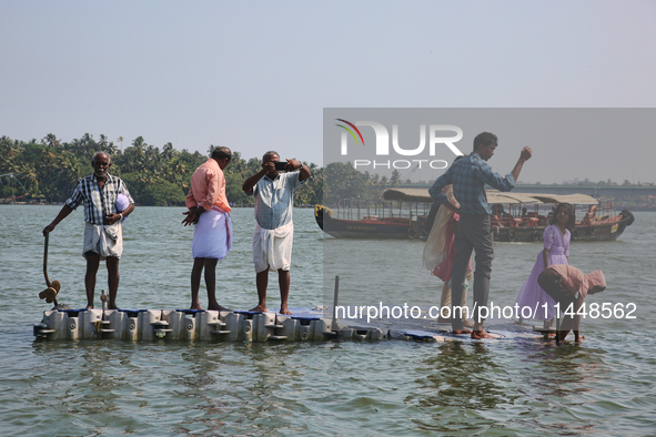 Indian tourists are taking photos from a small floating pier at Sambranikodi Island in Kerala, India, on April 06, 2024. Sambranikodi Island...