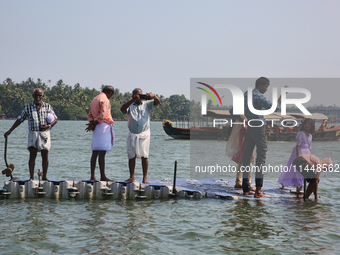 Indian tourists are taking photos from a small floating pier at Sambranikodi Island in Kerala, India, on April 06, 2024. Sambranikodi Island...