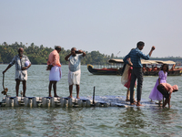 Indian tourists are taking photos from a small floating pier at Sambranikodi Island in Kerala, India, on April 06, 2024. Sambranikodi Island...