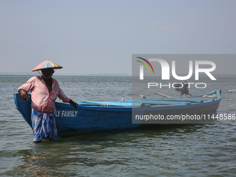 A boatman is waiting for Indian tourists to hire his services at Sambranikodi Island in Kerala, India, on April 06, 2024. Sambranikodi Islan...