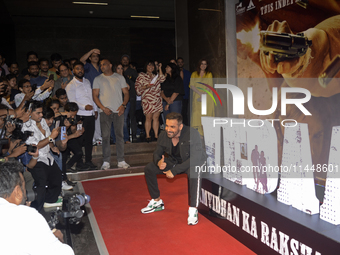 Indian actor John Abraham is reacting to the media during a movie Vedaa trailer launch event in Mumbai, India, on August 1, 2024. (