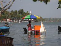 A woman is selling snacks at a small snack stand in the water along Sambranikodi Island in Kerala, India, on April 06, 2024. Sambranikodi Is...