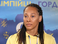 Ukrainian epee fencer Dzhoan Feybi Bezhura, who is losing 13-14 to French athlete Auriane Mallo-Breton, is being pictured upon returning fro...