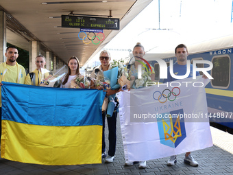 Ukrainian judoka Dilshot Khalmatov, coach Yuliia Kaiukova, Ukrainian artistic gymnast Anna Lashchevska, coach Svitlana Kuznietsova, and Ukra...