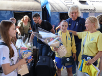 Ukrainian artistic gymnast Anna Lashchevska (L) and coach Yuliia Kaiukova (2nd R) are being pictured during the welcome ceremony on the plat...