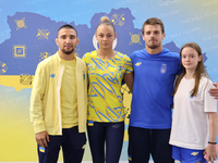 Ukrainian judokas Dilshot Khalmatov, Daria Bilodid, Bohdan Yadov, and Ukrainian artistic gymnast Anna Lashchevska (L to R) are posing for a...