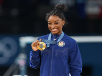 Gold medalist and winner Simone Biles of USA  poses during medal ceremony victory after the women's final all-round competition on day six o...