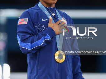 Gold medalist and winner Simone Biles of USA  poses during medal ceremony victory after the women's final all-round competition on day six o...