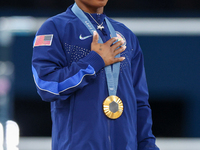 Gold medalist and winner Simone Biles of USA  poses during medal ceremony victory after the women's final all-round competition on day six o...