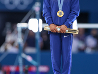 Gold medalist and winner Simone Biles of USA  poses during medal ceremony victory after the women's final all-round competition on day six o...