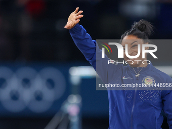 Gold medalist and winner Simone Biles of USA  poses during medal ceremony victory after the women's final all-round competition on day six o...