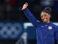 Gold medalist and winner Simone Biles of USA  poses during medal ceremony victory after the women's final all-round competition on day six o...