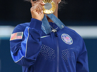 Gold medalist and winner Simone Biles of USA  poses during medal ceremony victory after the women's final all-round competition on day six o...