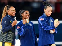 Silver medalist Rebeca Andrade of Team Brazil (L)  Gold medalist and winner Simone Biles (C)  of USA and bronze medalist Suni Lee of USA  ar...